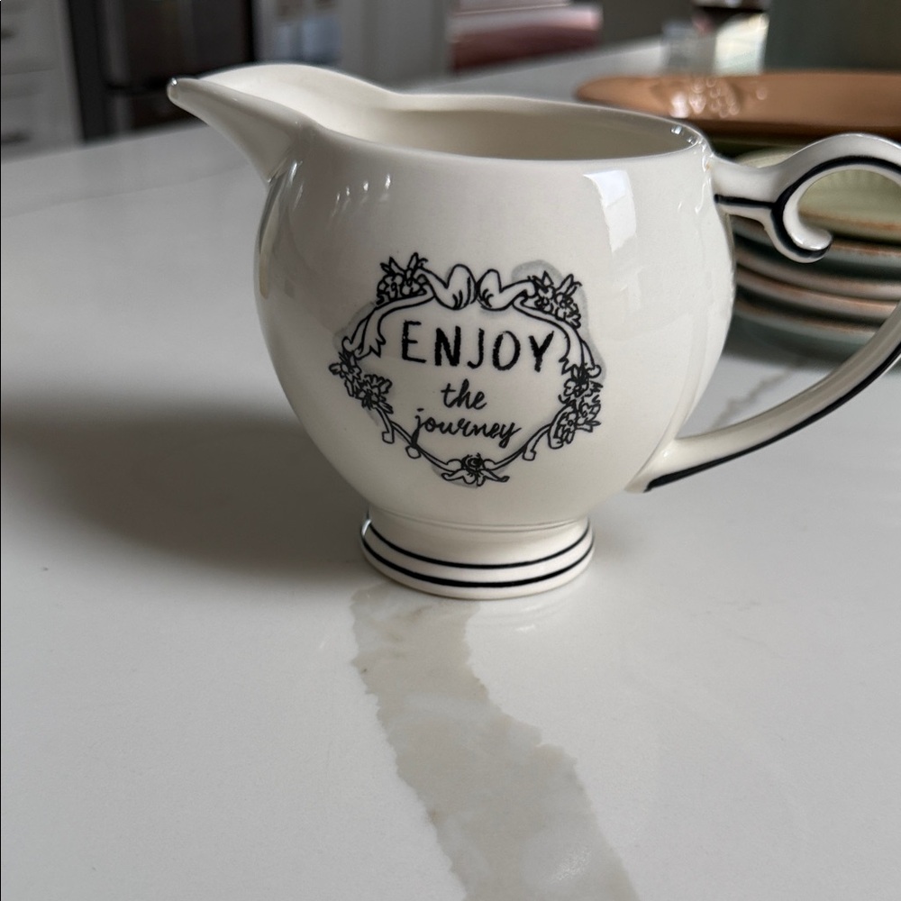 Elegant Cream Pitcher with Black Accents